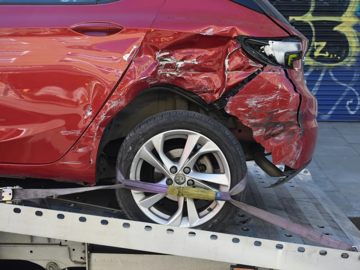 Damaged vehicle being documented after a car accident