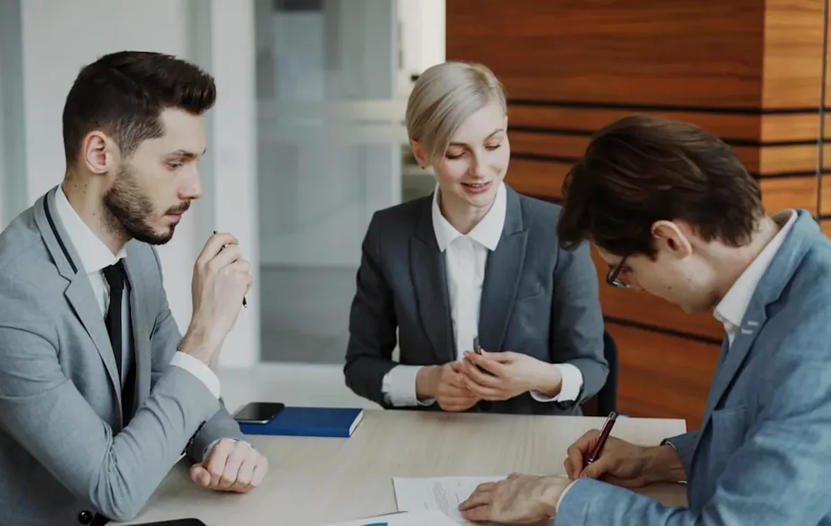 Attorneys reviewing personal injury claim documents with a client