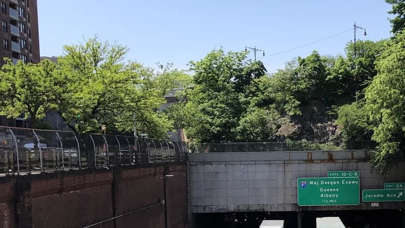 Signs for the Major Deegan Expressway and Jerome Avenue above the Cross Bronx Expressway, seen from the Morris Avenue overpass in the Bronx.