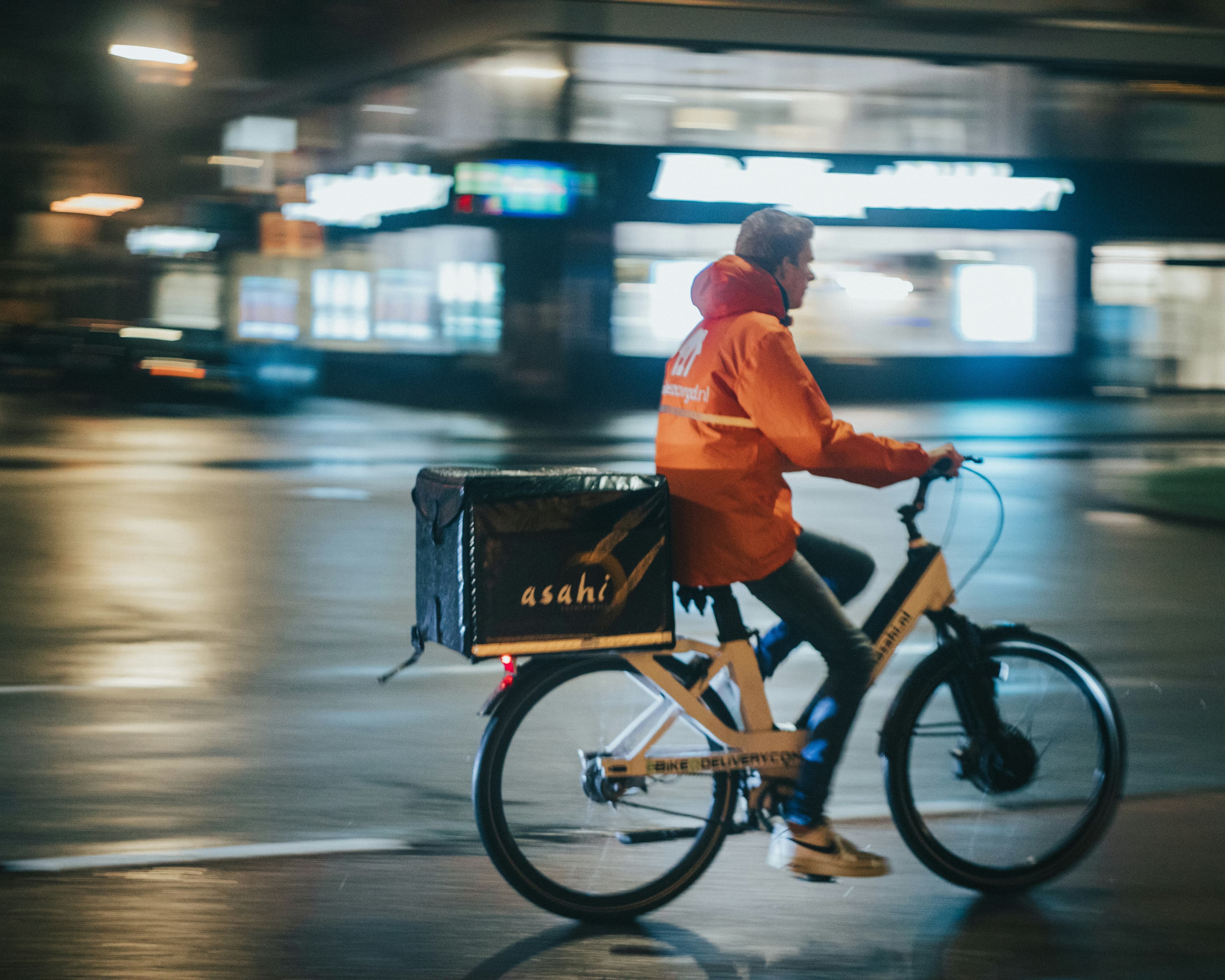 E-Bike Delivery Worker at Night