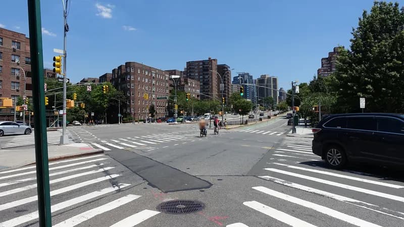High-visibility crosswalks and signals where Queens Boulevard meets Yellowstone Boulevard in Forest Hills, Queens.