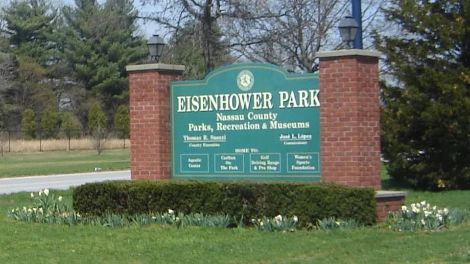 The Eisenhower Park west entrance sign for Nassau County Parks, Recreation and Museums in East Meadow, Long Island.