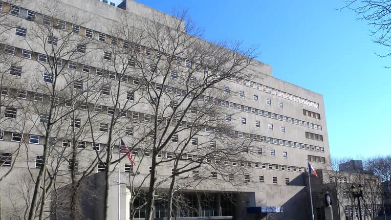 The Kings County Supreme Court building at 360 Adams Street in Downtown Brooklyn, behind bare winter trees.