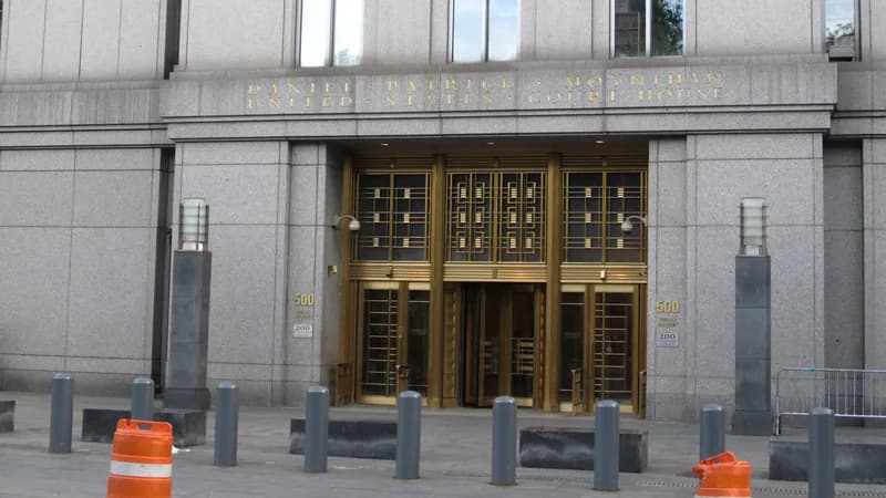 The bronze entrance doors and carved name of the Daniel Patrick Moynihan United States Courthouse at 500 Pearl Street in Manhattan.