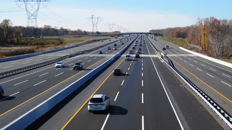 The widened New Jersey Turnpike near Robbinsville, with separate inner and outer roadways and traffic heading south.